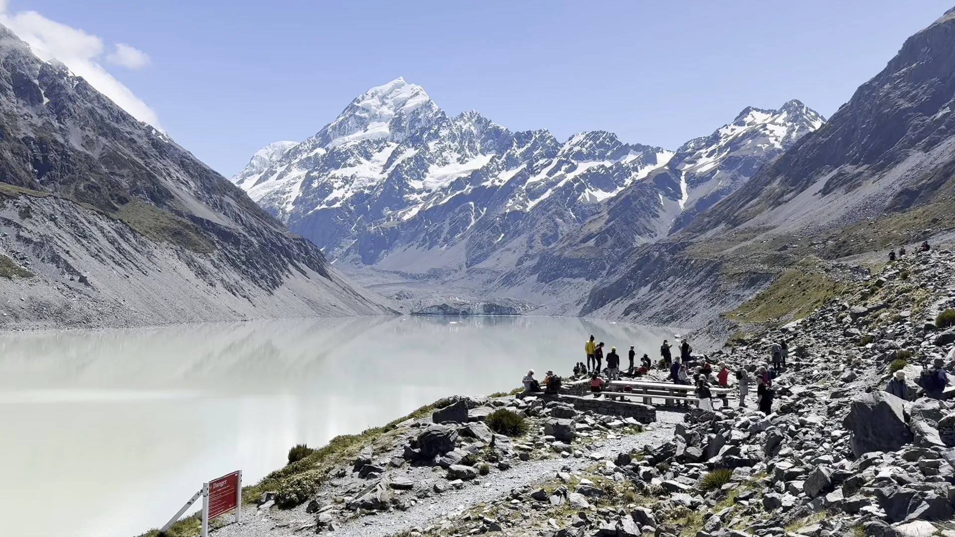 Hikers gathered above Hooker Lake at the end of the track