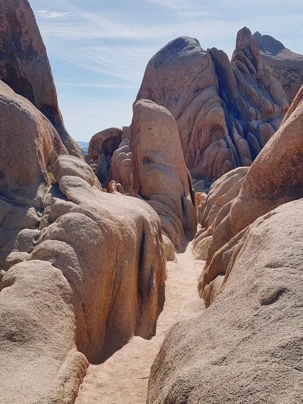 A narrow scramble between boulders near Arch Rock