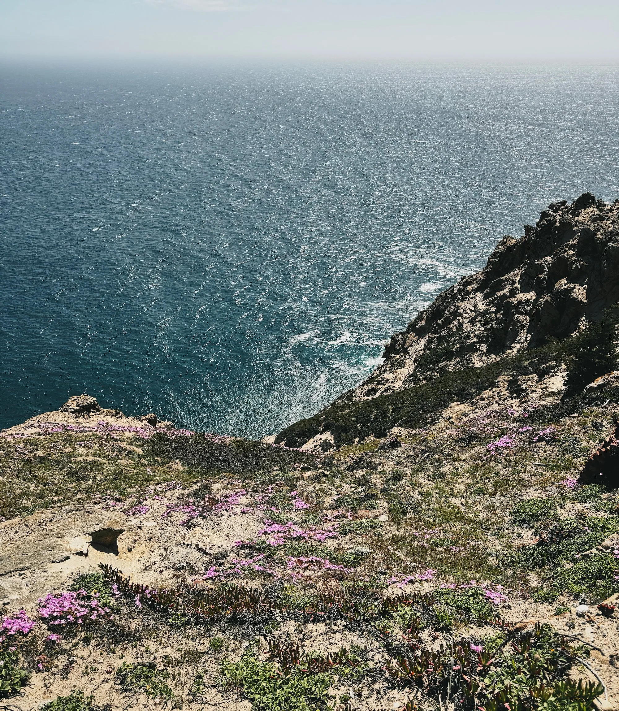 A lighthouse compound building overlooking the coast