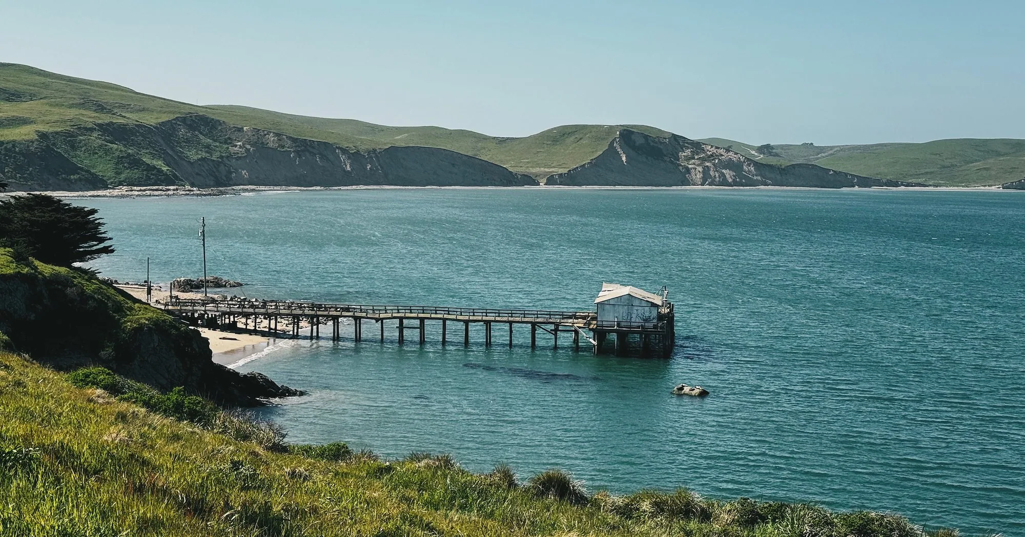 The fish docks at Chimney Rock extending into Drakes Bay