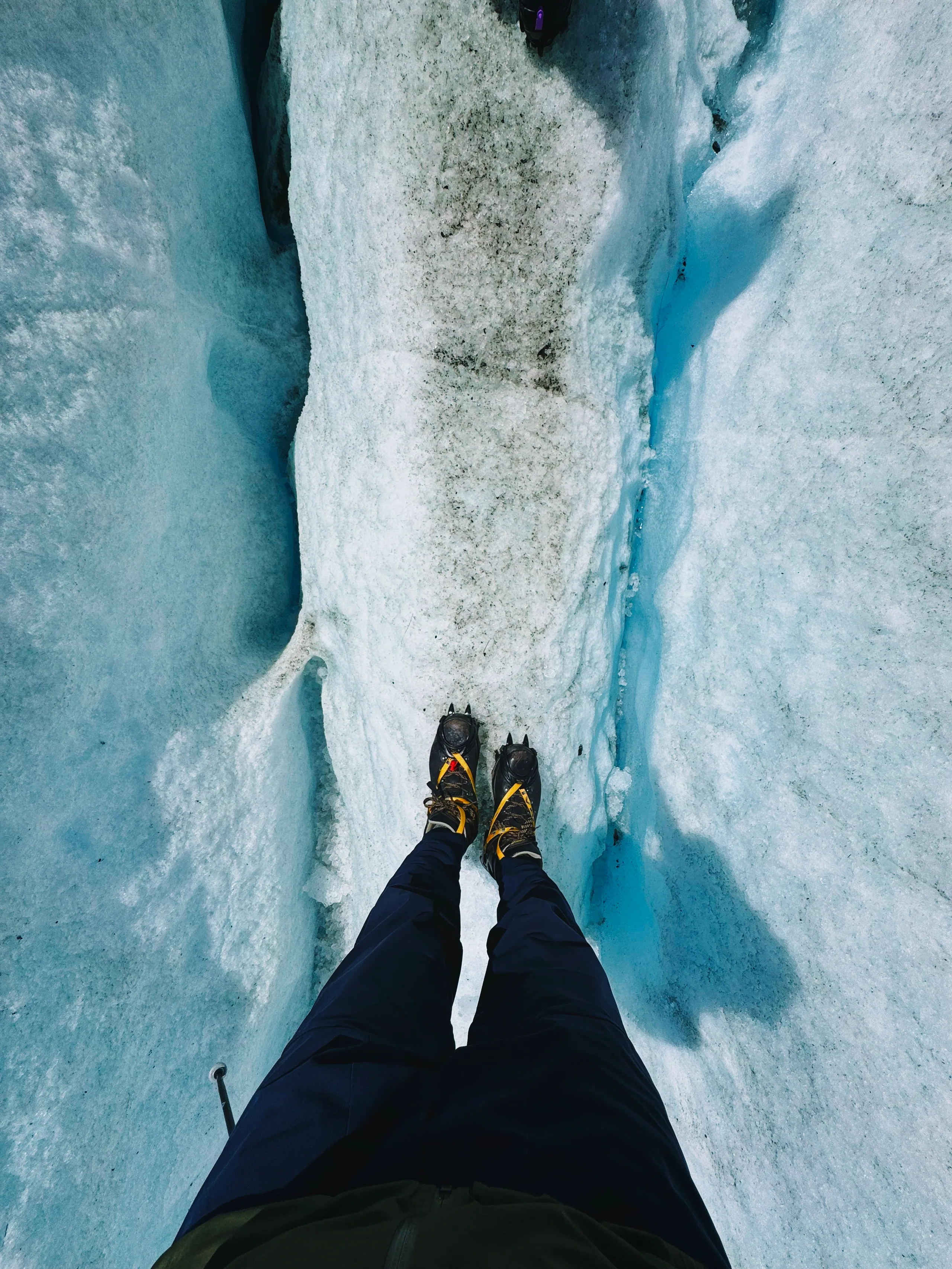 Hikers crossing a field of rough ice and snow