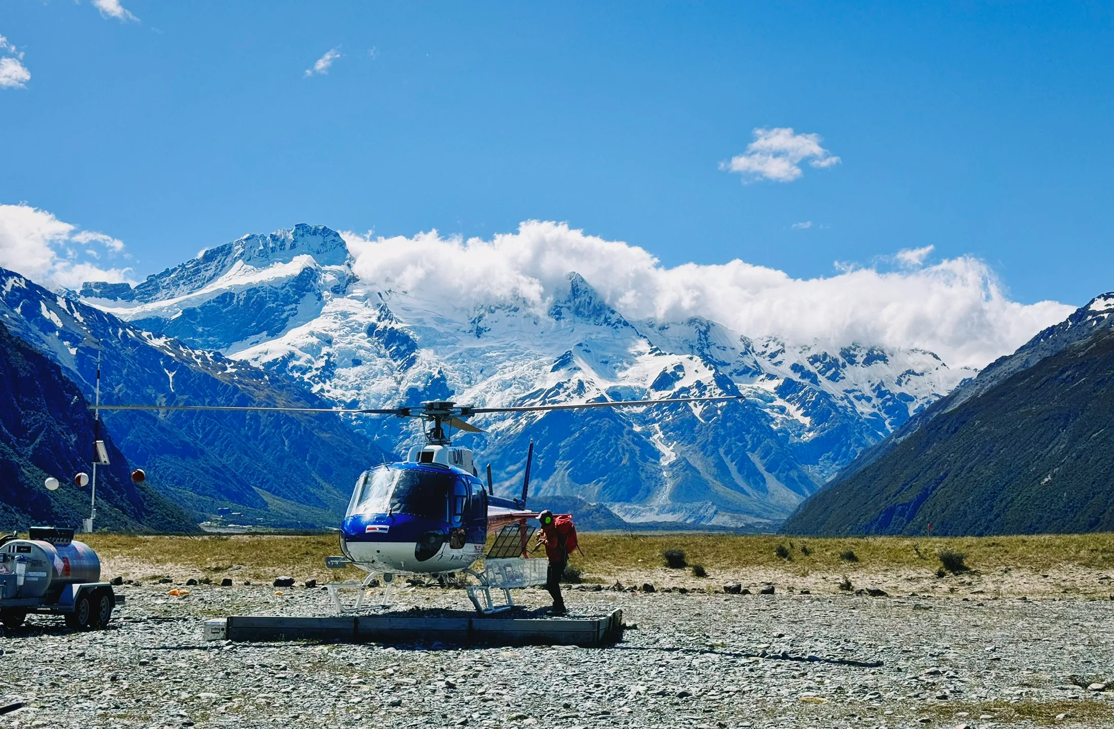 Passengers unloading a helicopter at Mount Cook Airport